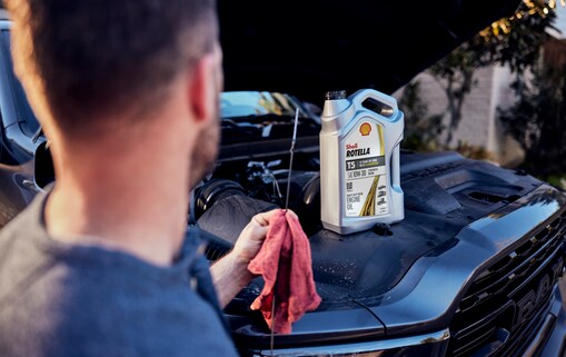 man-adding-oil-in-car1