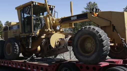 truck hauling tractor