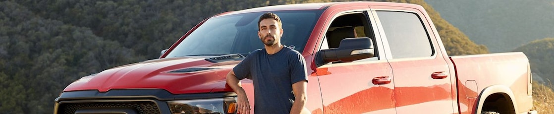 man standing near jeep