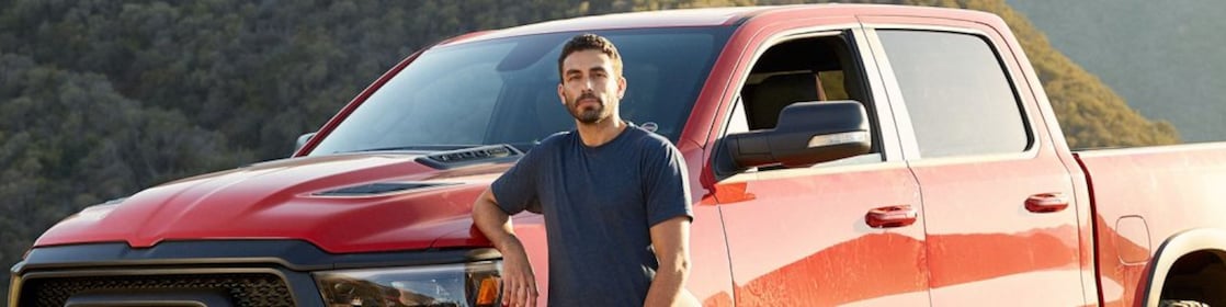 man standing near jeep