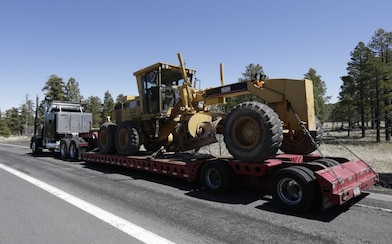 truck hauling tractor