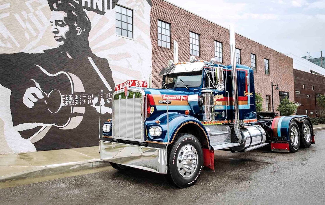 truck parked next to painted wall
