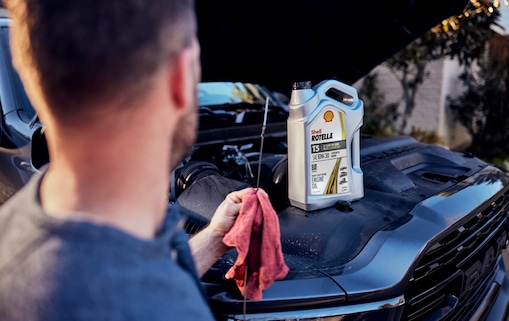 man-adding-oil-in-car1